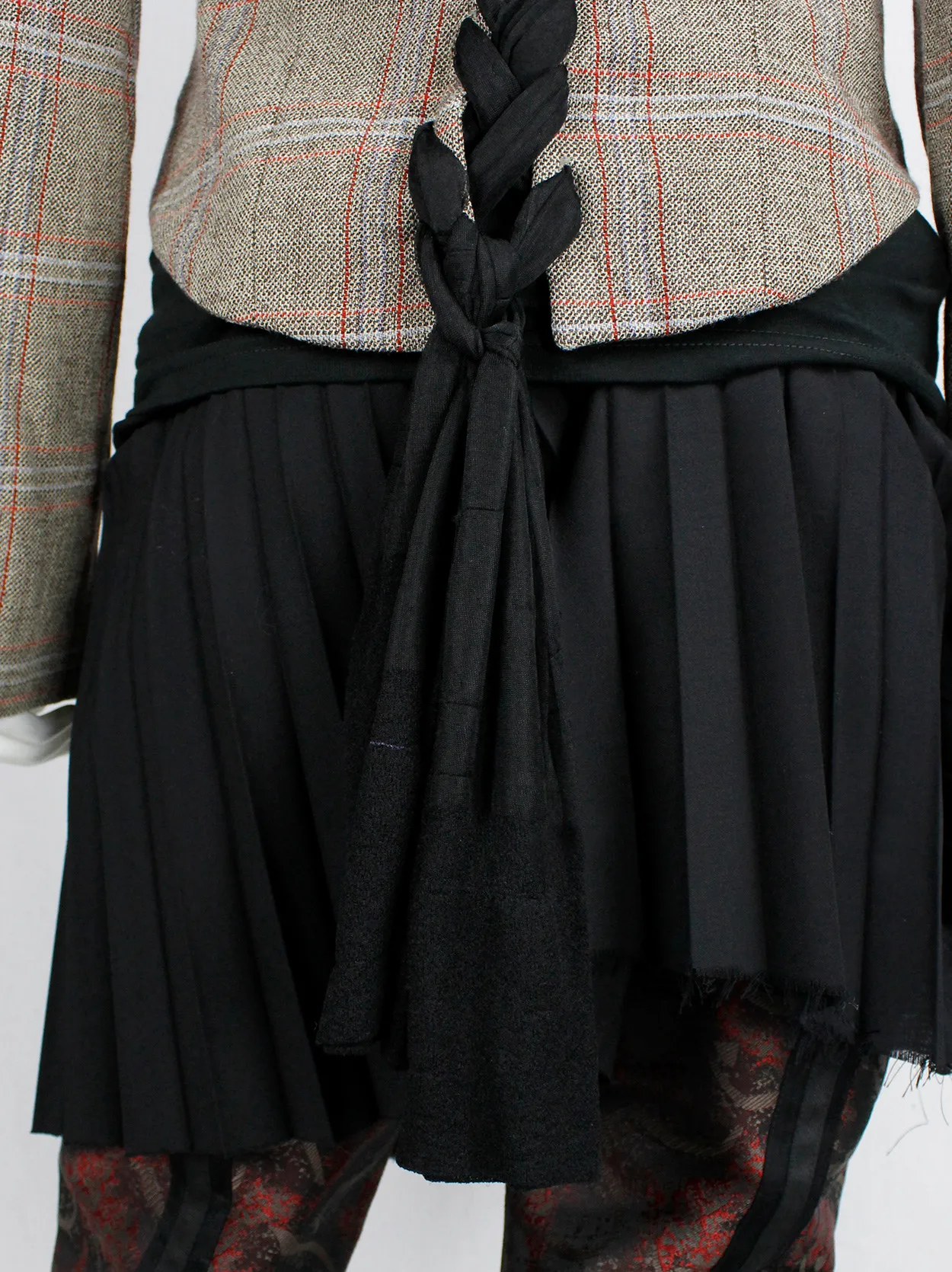 A.F. Vandevorst tartan corset jacket with braided pantyhose along the back — fall 2000