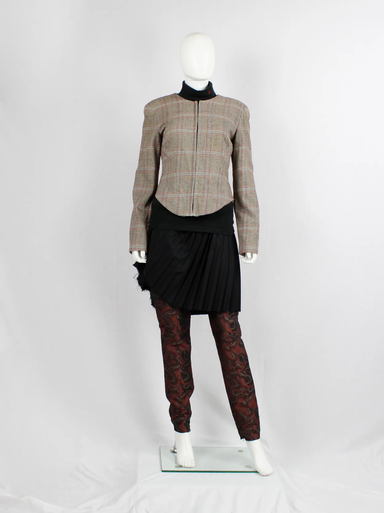 A.F. Vandevorst tartan corset jacket with braided pantyhose along the back — fall 2000