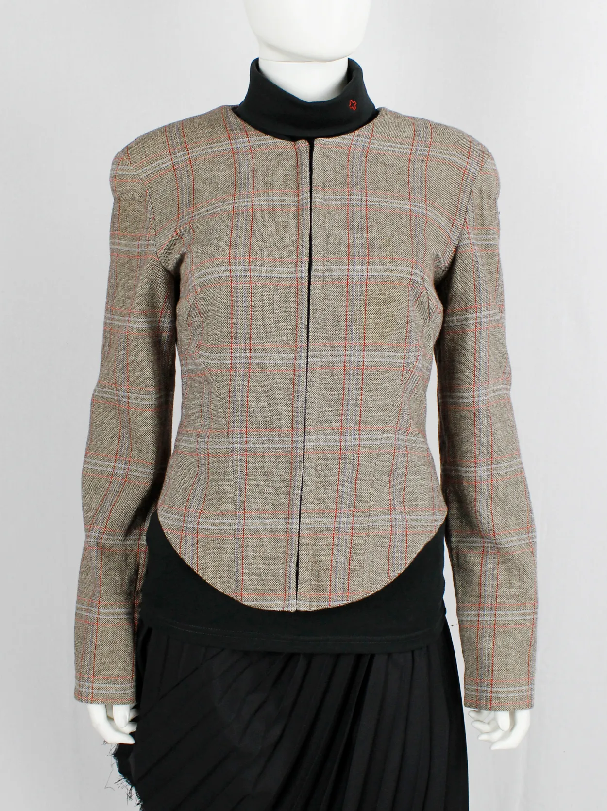 A.F. Vandevorst tartan corset jacket with braided pantyhose along the back — fall 2000