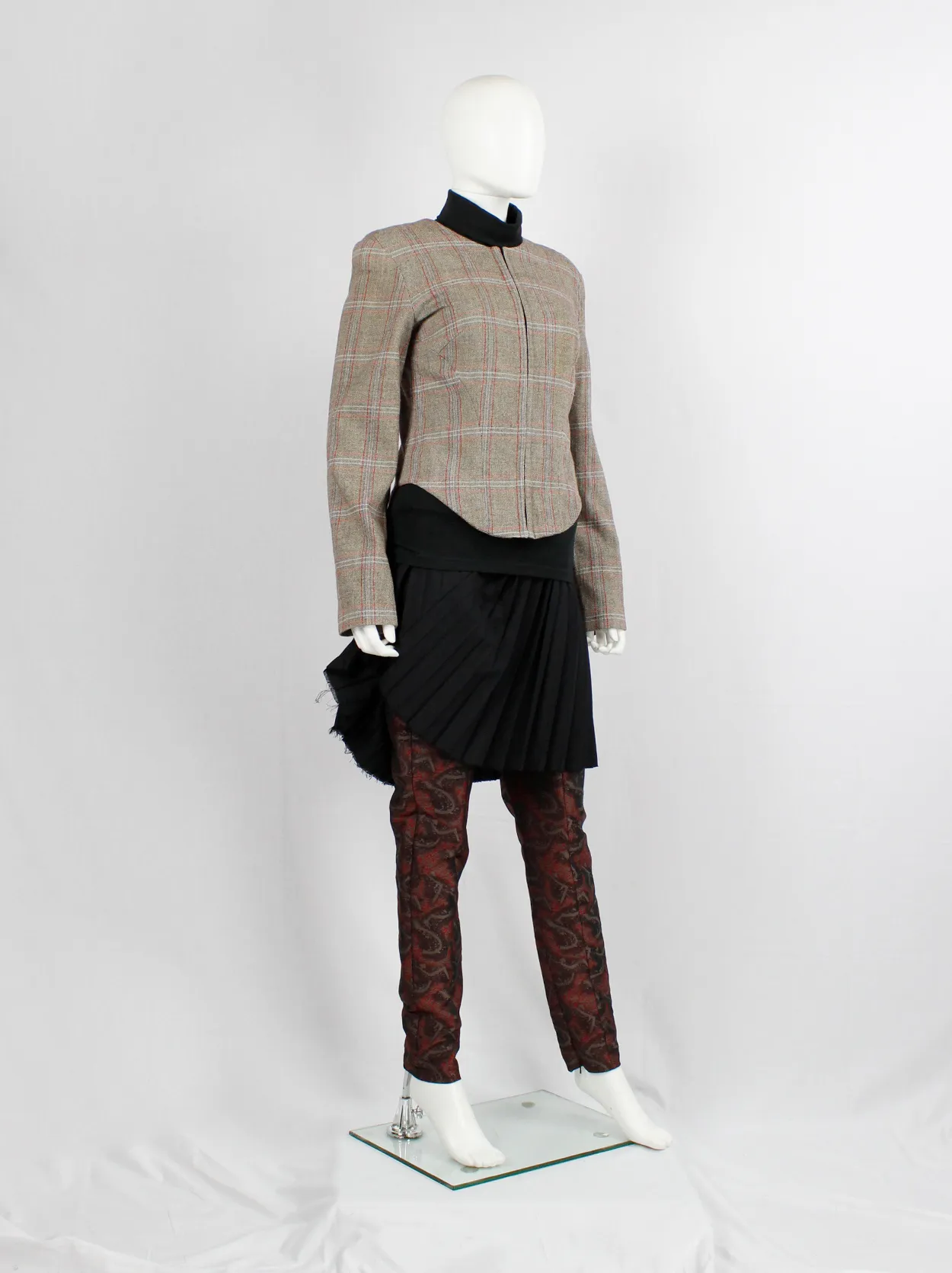 A.F. Vandevorst tartan corset jacket with braided pantyhose along the back — fall 2000