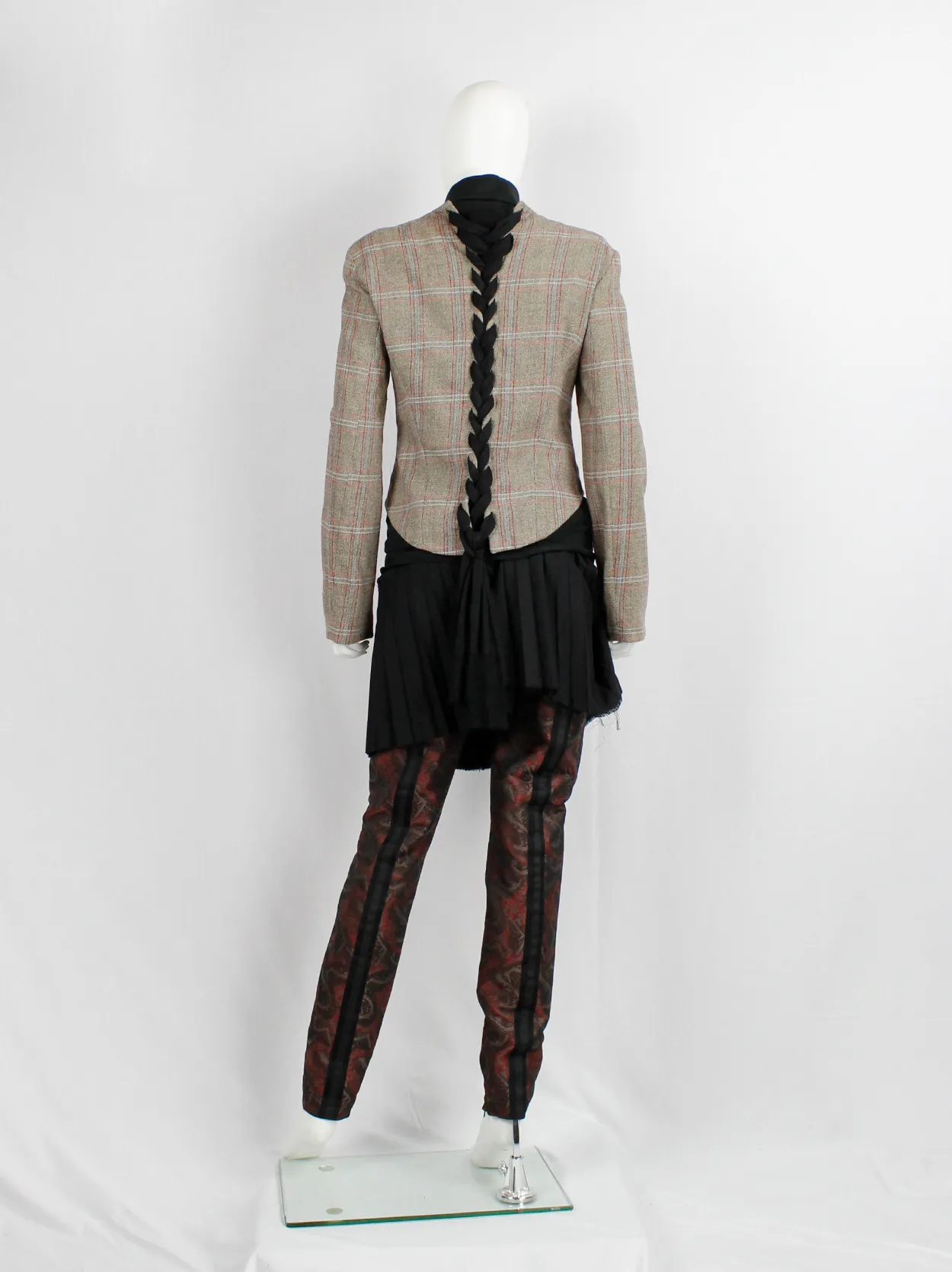 A.F. Vandevorst tartan corset jacket with braided pantyhose along the back — fall 2000