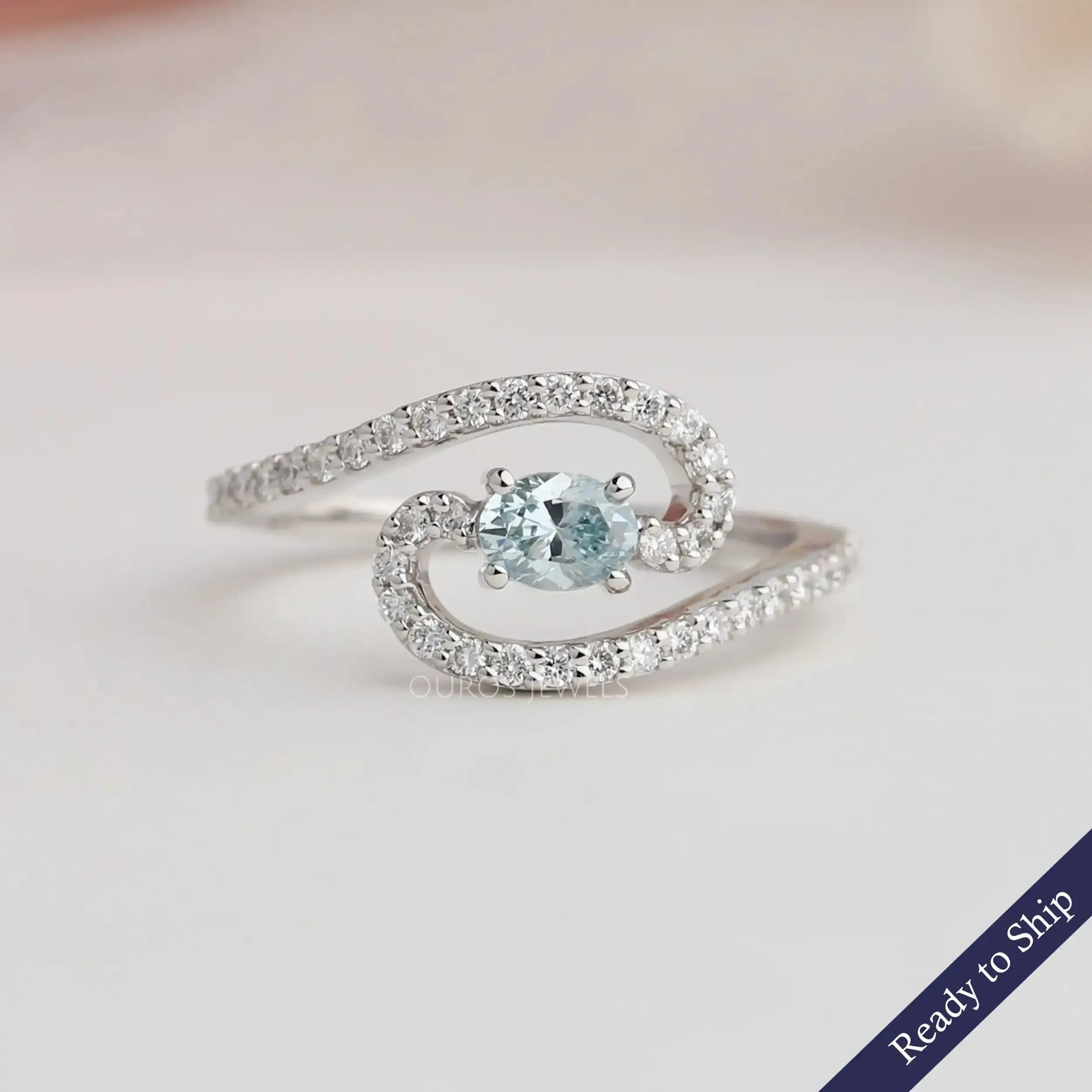 Blue Oval Diamond Bypass Engagement Ring