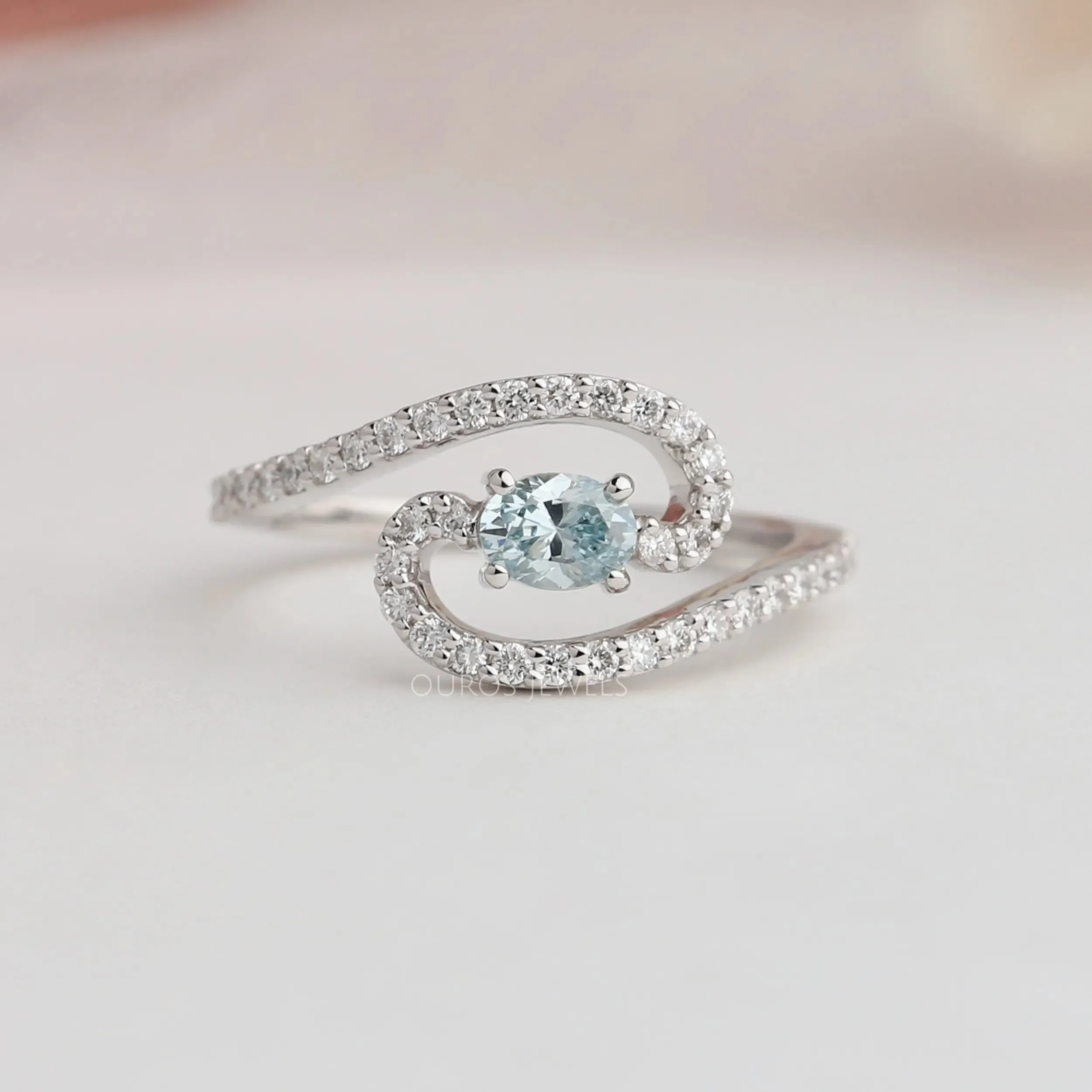 Blue Oval Diamond Bypass Engagement Ring