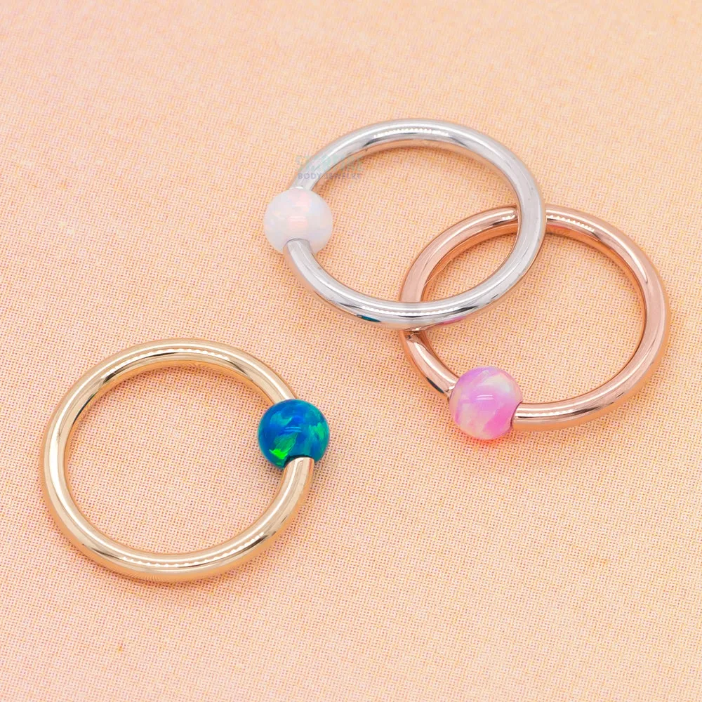 Captive Bead Ring (CBR) in Gold with Dark Blue Opal Captive Bead